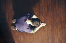 A man kneeling in prayer 