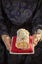 Roulade With Coffee Cream And Holiday Glitter in Background