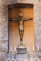 crucifix above an altar 