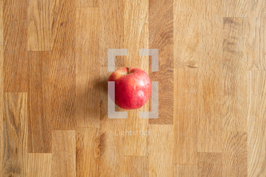 apple on a wood floor 