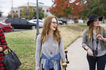 college students walking to class on campus 
