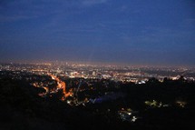 View of city lights from a mountain top.