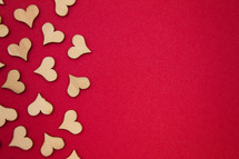 wood heart cutouts on red 