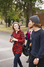 college students walking to class on campus 