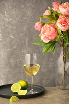 Glass Of White Wine and Peony Flowers