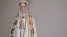 A statue of Mary with praying hands 
