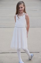 A shy little girl ready for a daddy daughter dance 