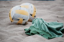 volley balls on a beach 
