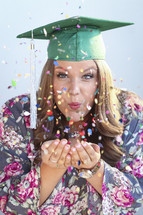 A graduate with confetti 
