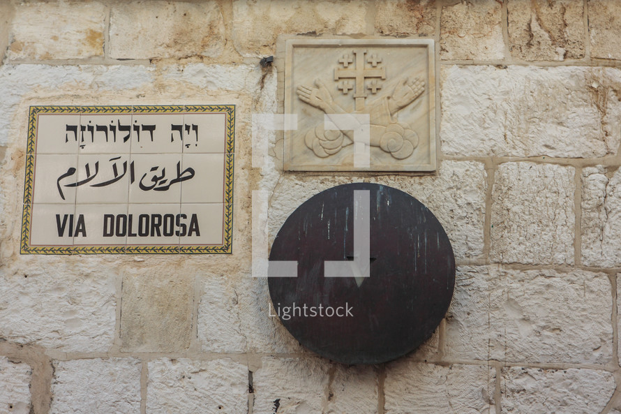 plagues on a wall in Israel along the "way of the cross"