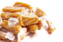 wrapped caramel candies on a white background 