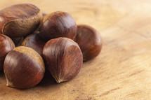 Group of hazelnuts on a wood table