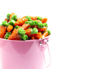 candy gummy carrots in a pink bucket for Easter 