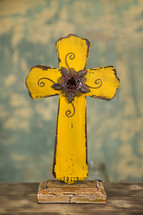 yellow wooden cross