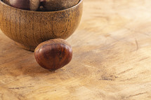 Group of hazelnuts on a wood table