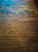 rainbow light on wood texture 