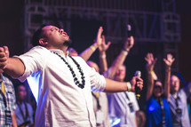 passionate worship leader holding a microphone 