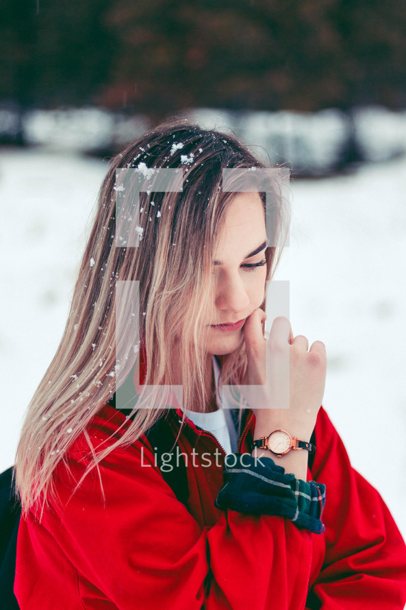 teen girl with snow in her hair 