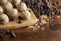 Coconut Chocolate Energy Balls on Wooden Butcher Block