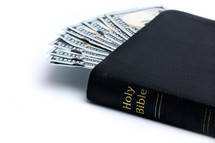 Ten one hundred dollar bills in a Bible.