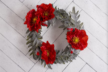  Floral Wreath with Poppies on a White Wooden Wall