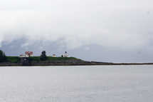 house and lighthouse on the coast of Alaska 