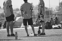 referees on a sports field 