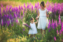 sisters in a field of purple flowers 