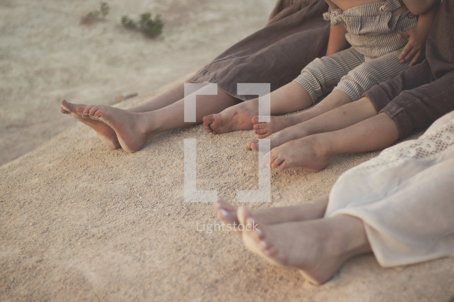 kids bare feet in beach sand 