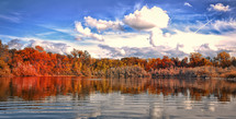 autumn forest lining a lake 