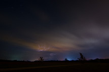 Lightning on the horizon of a night sky.