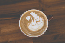 swan design in creamer in coffee 