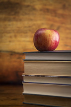 Education Background with a Stack of Books and an Apple