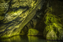 green moss rock walls in a cave 