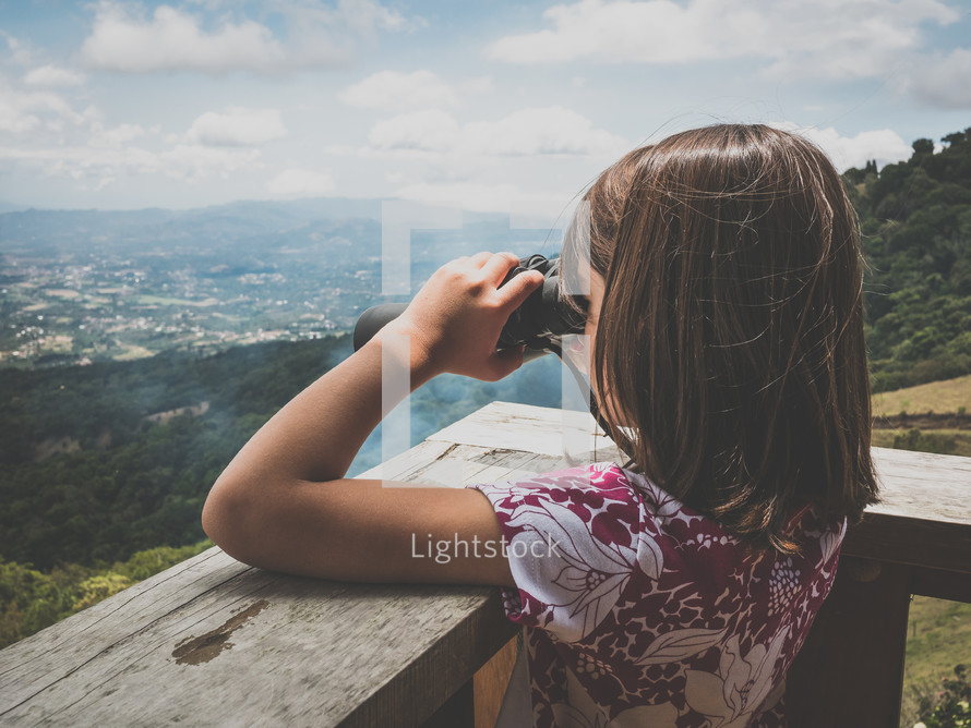 a little girl with binoculars 