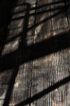 shadow on wood boards 