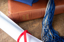 graduation cap on a Bible 