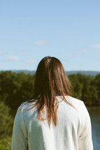 woman looking at a lake 