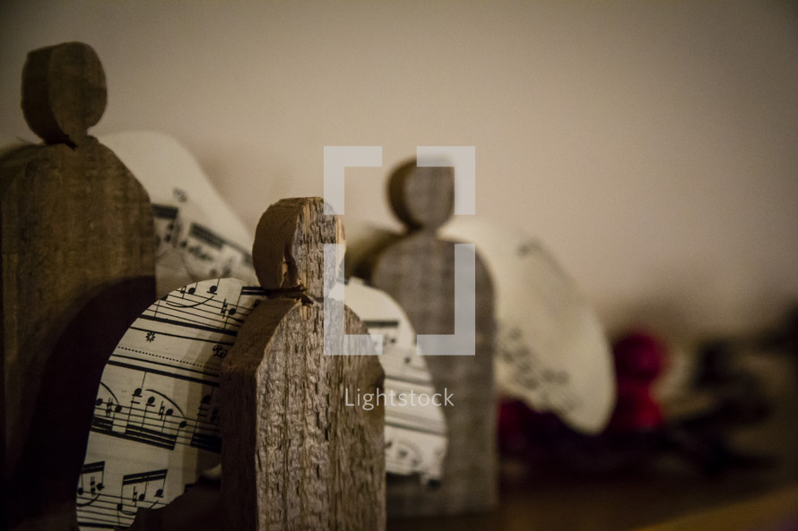 wooden angles and sheet music decorations 