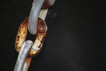 a rusty link in a chain 