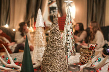 Christmas decorations and women gathered in a living room 