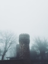 castle tower in fog 