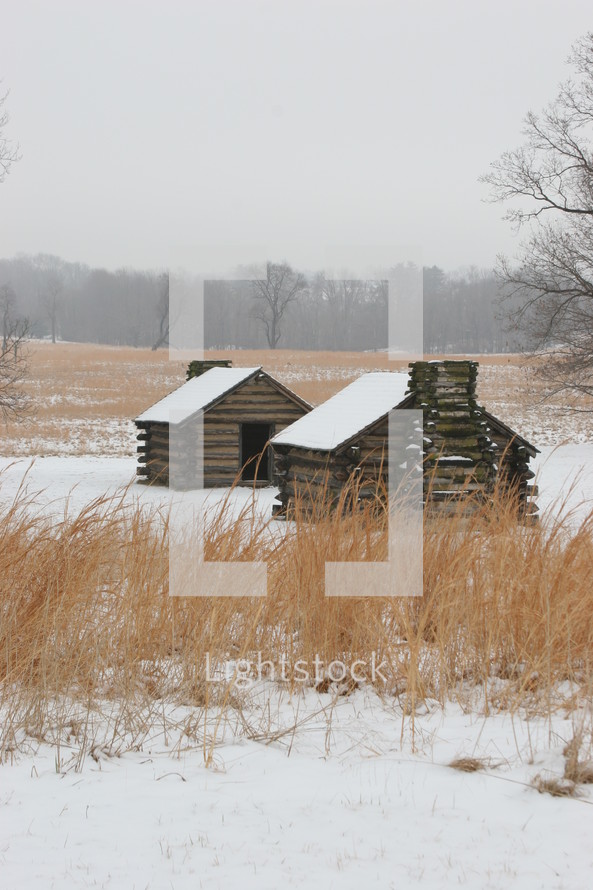 Valley Forge log cabins in the snow
