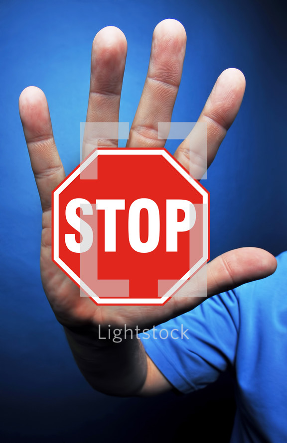 man with stop sign on his hand