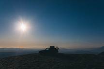 SUV parked on a mountaintop 
