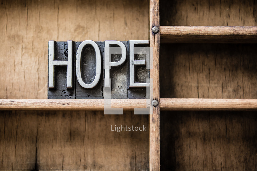 word hope on a bookshelf 