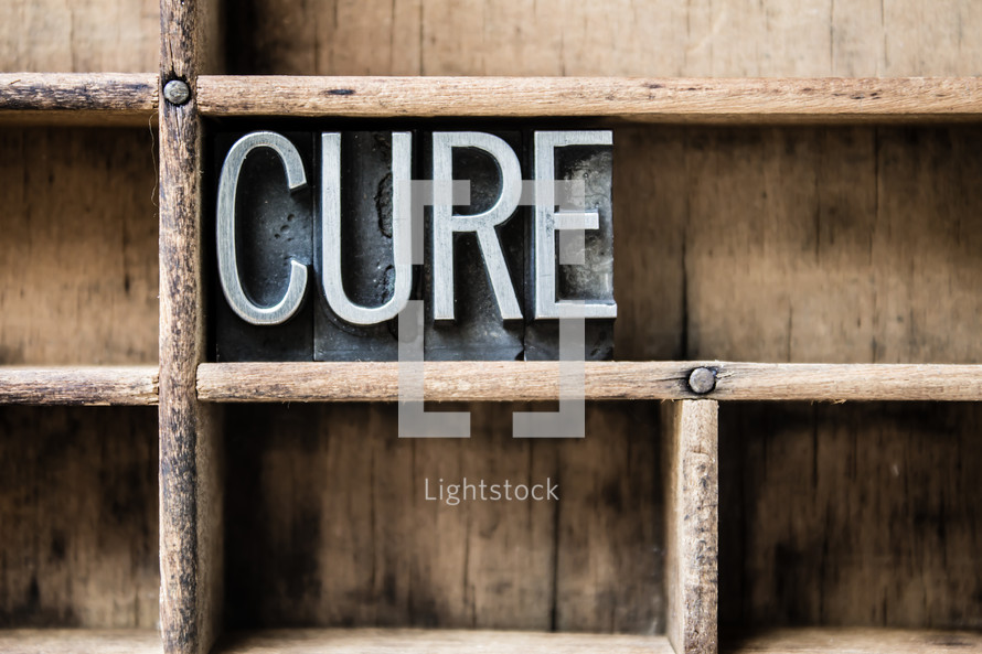 word cure on a bookshelf 