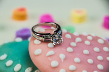 A diamond engagement ring on a Valentine cookie.