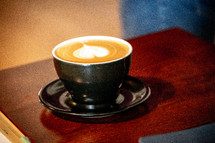 heart shaped creamer in coffee