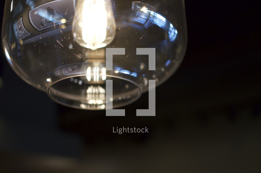 lightbulb in a glass lantern 